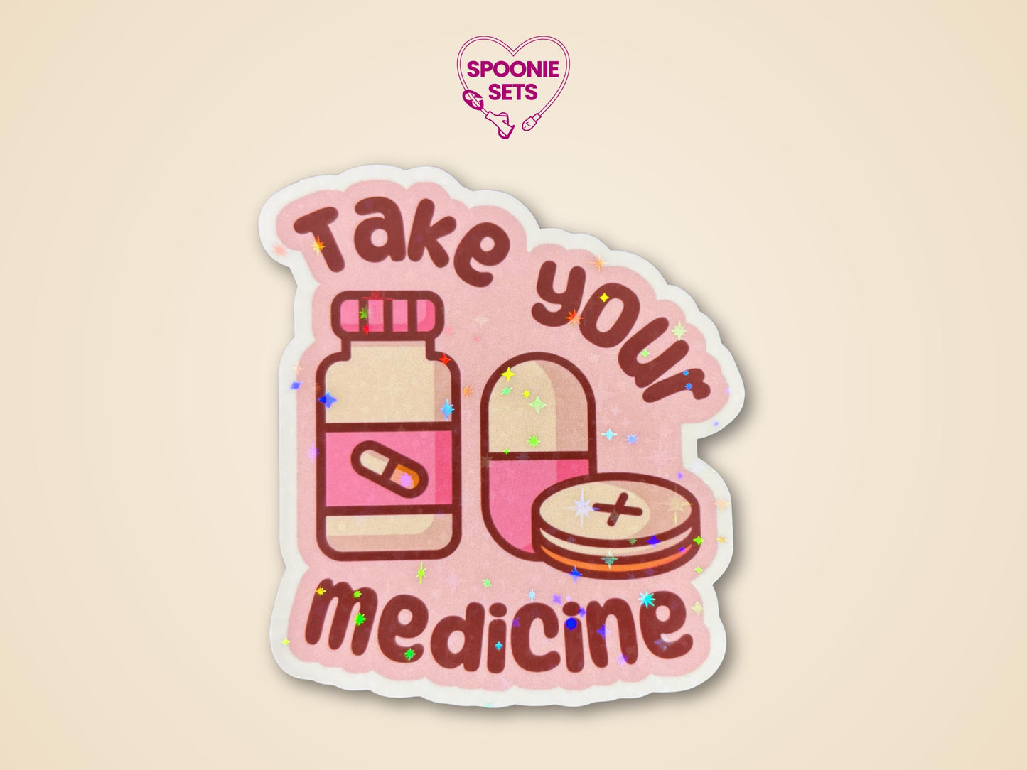 Pink "Take Your Medicine" sticker with a pill bottle and pills, featuring a holographic glitter laminate.