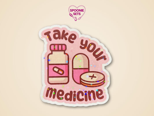 Pink "Take Your Medicine" sticker with a pill bottle and pills, featuring a holographic glitter laminate.