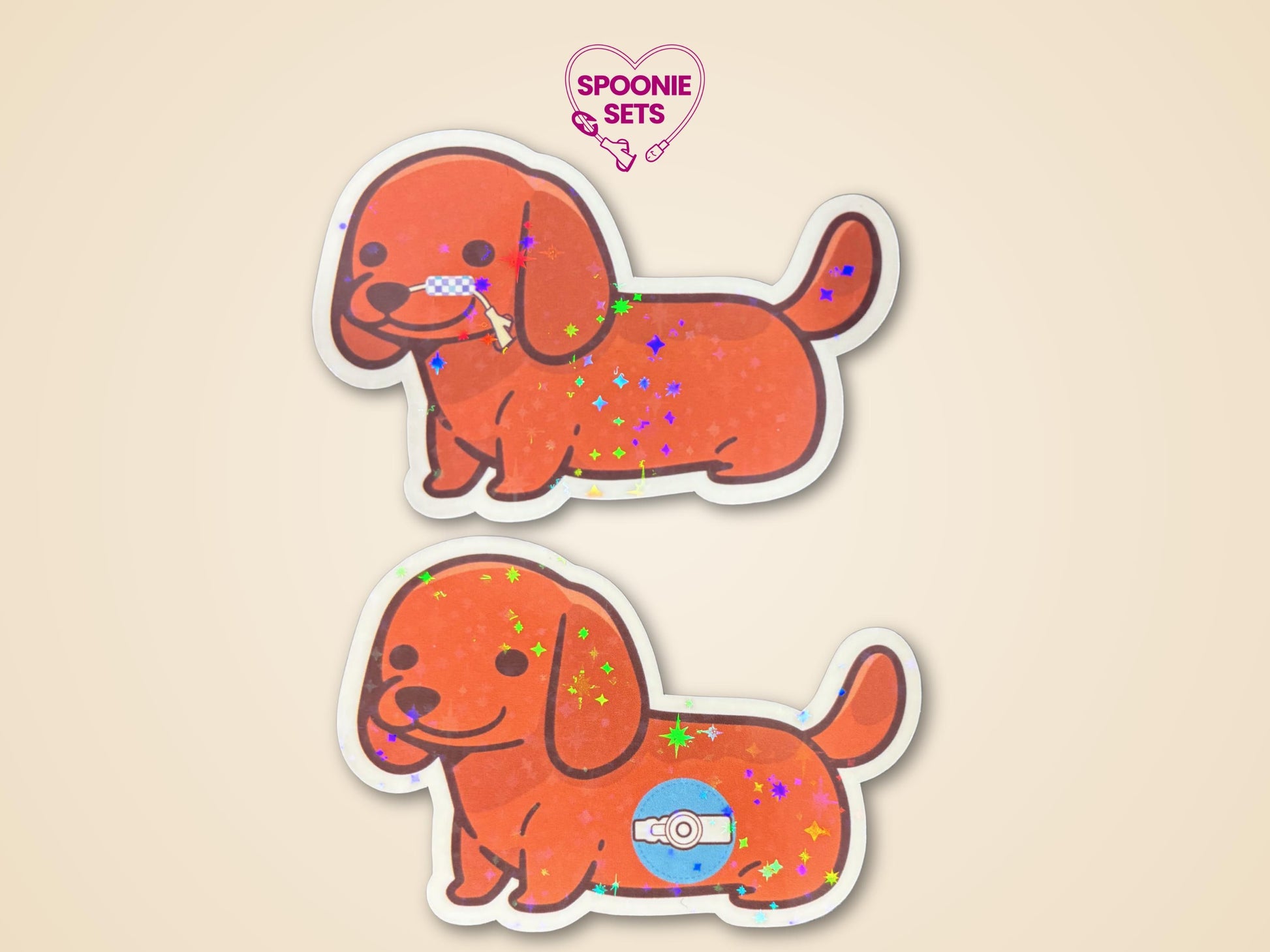Two holographic glitter laminate dachshund stickers. One dog has a feeding tube, the other a G-tube button.