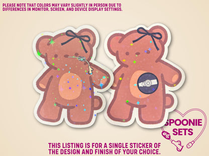 Holographic glitter sticker of two brown teddy bears, one with a feeding tube, the other with a port.