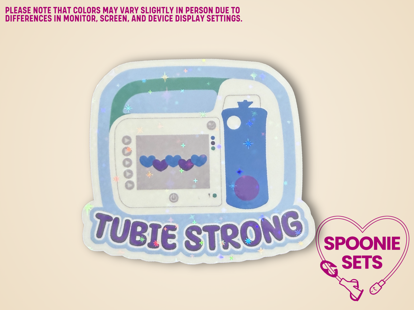 Sticker of a white, green, and blue feeding tube pump with the text 'Tubie Strong' in a holographic finish