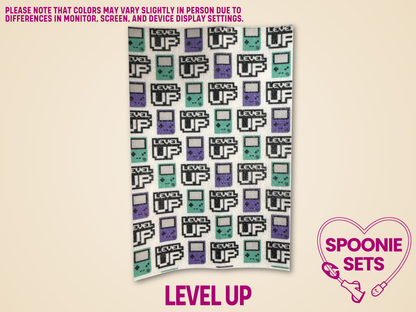 White hypafix tape with "Level Up" and purple and green game consoles.