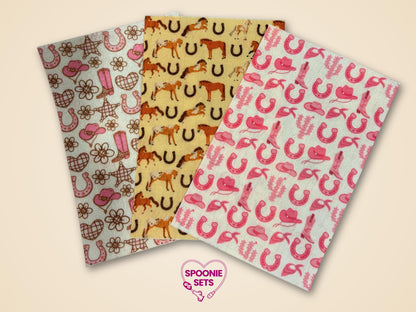 Three sheets of Western Tubie Tape: pink cowgirl, horses, and horseshoe patterns on Hypafix tape.