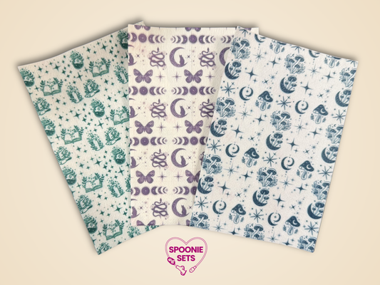Three sheets of decorative Hypafix tubie tape: green potions, blue mushrooms, and purple magic designs.