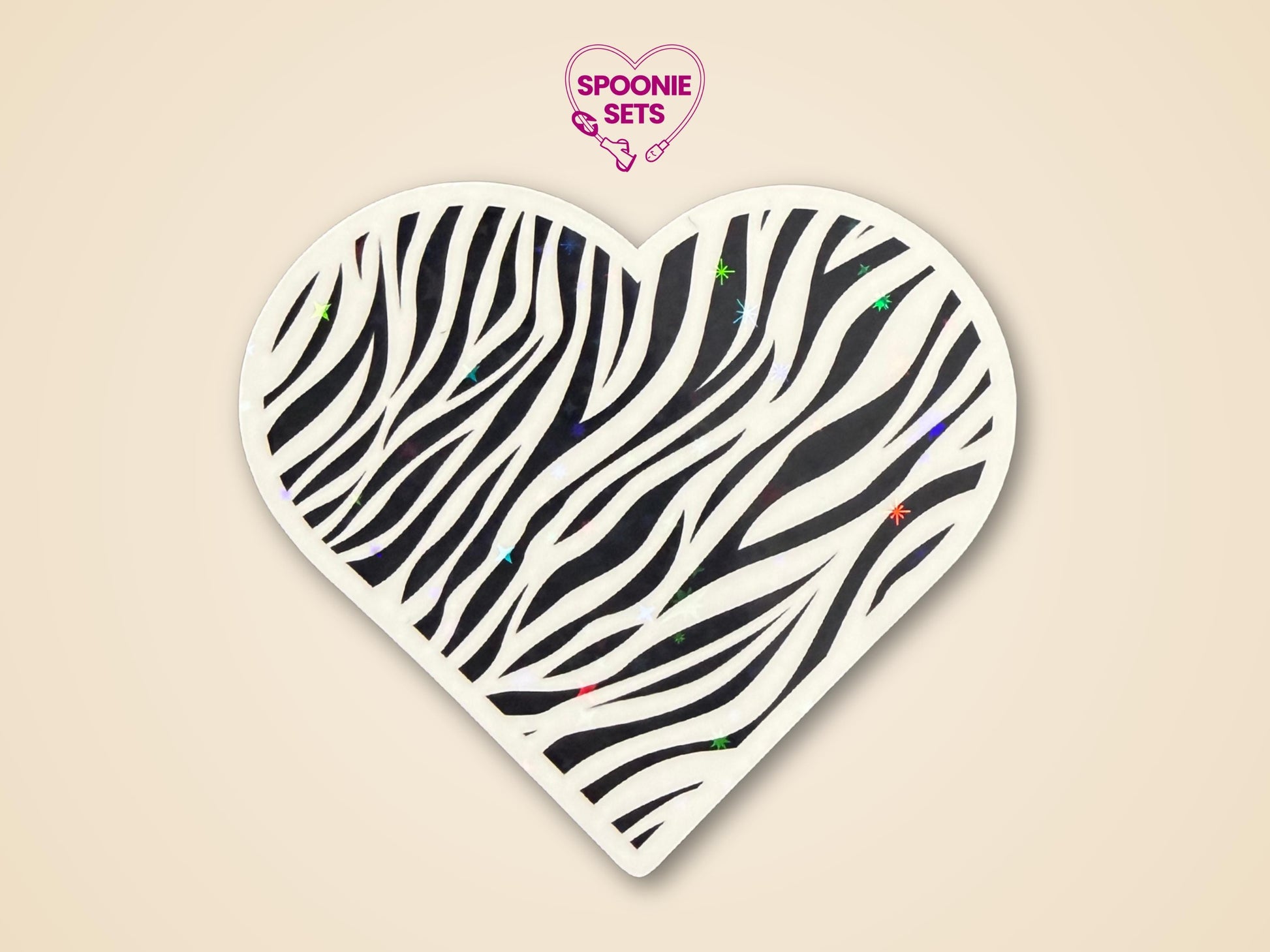 Heart-shaped zebra print sticker with black stripes and subtle holographic glitter, promoting rare disease awareness.
